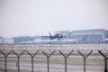 Lufthansa plane landing in Munich Airport, winter time with snow